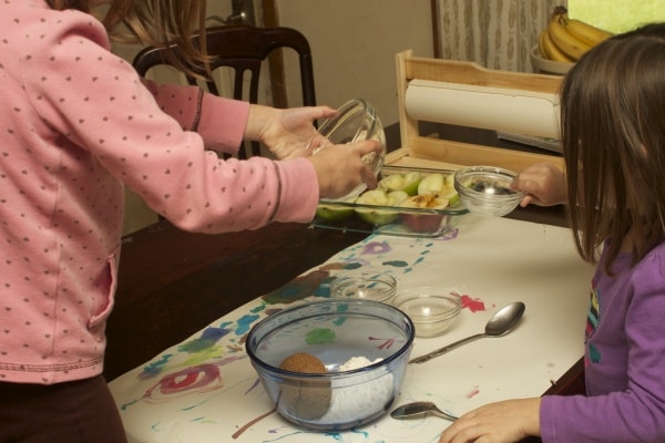 preschoolers mixing up a recipe at home