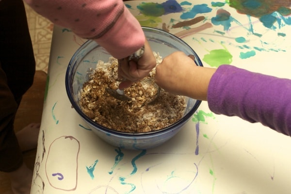 little hands stirring up ingredients