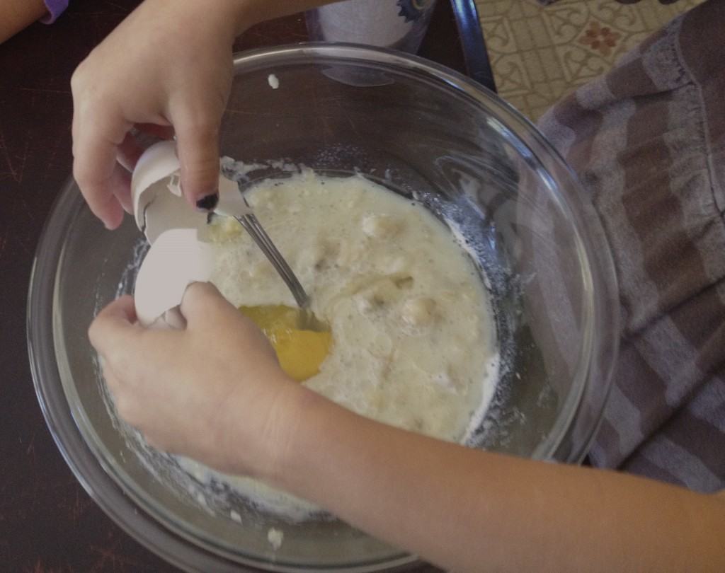 girl cracking an egg