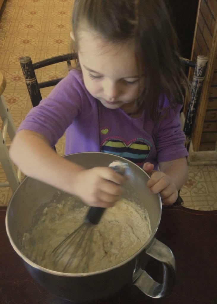 girl mixing up banana bread