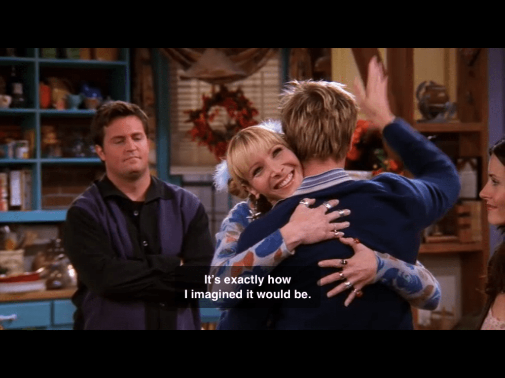 Screen cap of Phoebe hugging Brad Pitt on Friends