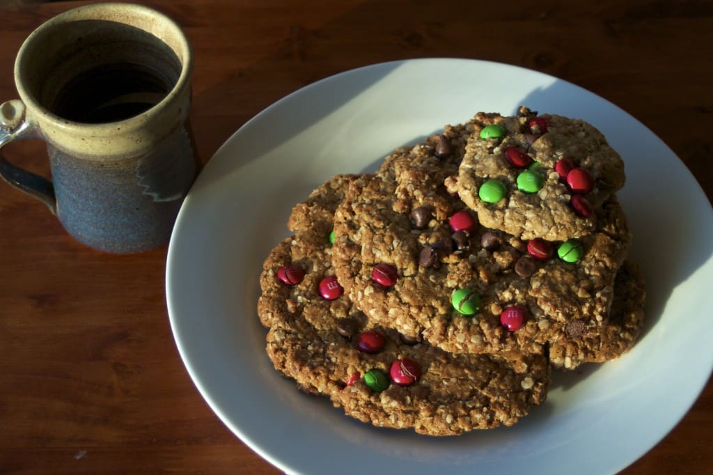 monster cookies on a plate with coffee