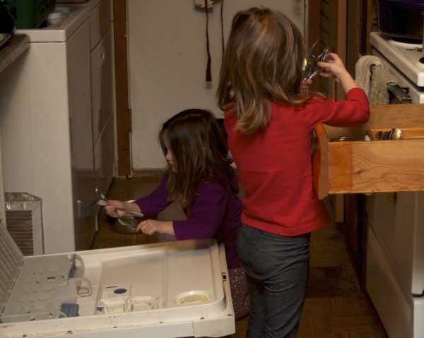 sister unloading the dishwasher