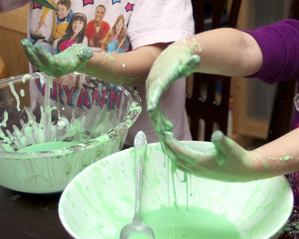 kids playing with green oobleck