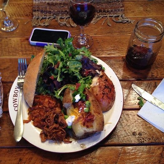 full plate of food at a friendly dinner party