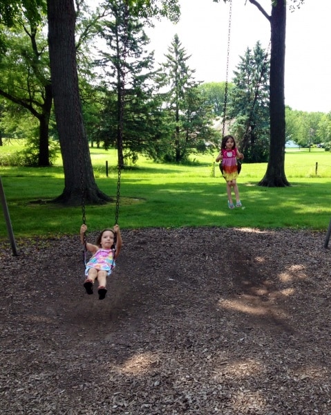 Sisters on the swings at Stoppenbach Park, Jefferson, Wisconsin