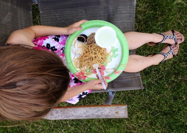 Little girl having a picnic at Riverfront Park, Jefferson, Wisconsin