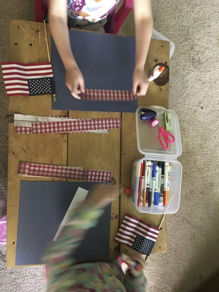 Girls crafting with scrapbook paper