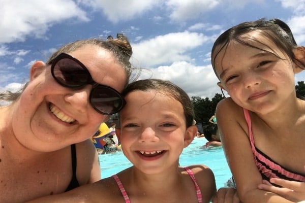 mom and daughters at the swimming pool