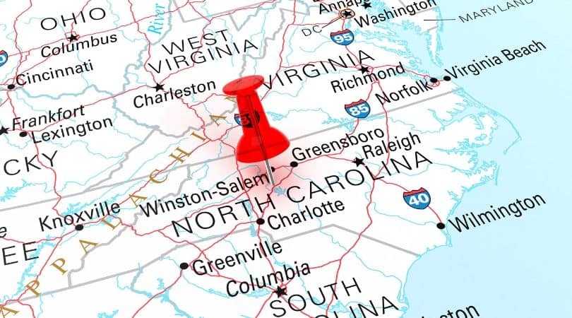 digital map of North Carolina with a red pin in the middle of the state