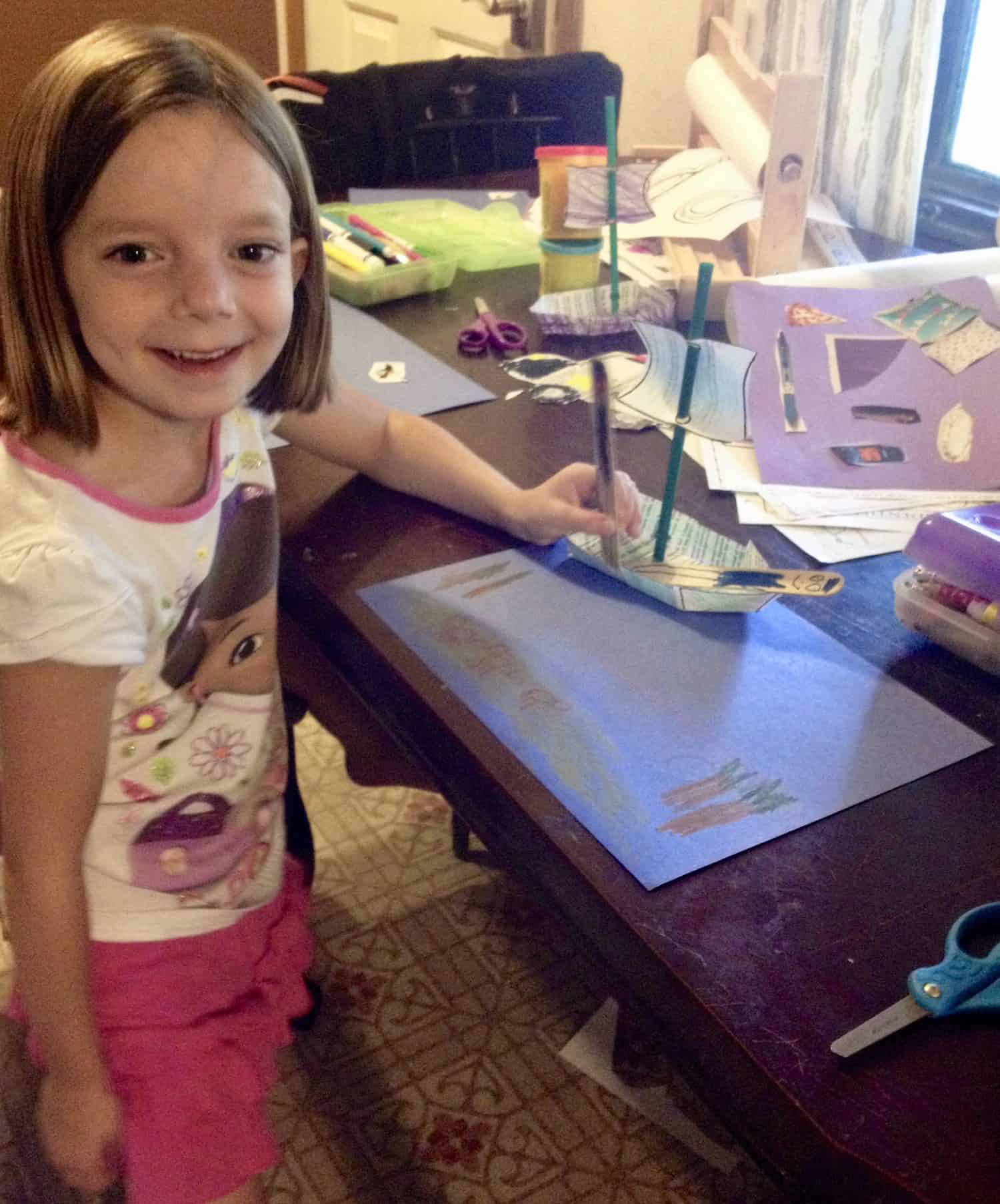 preschooler with a printable pirate ship craft