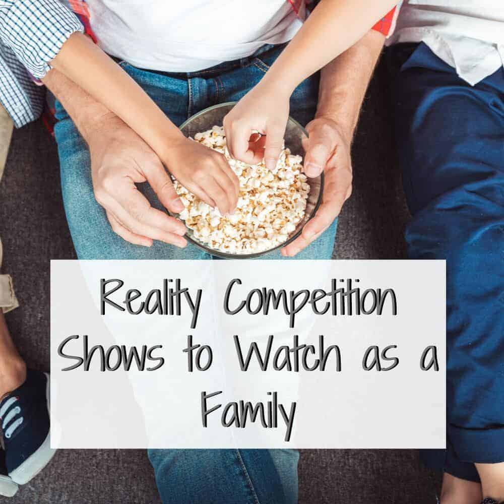 family reaching for popcorn from a bowl