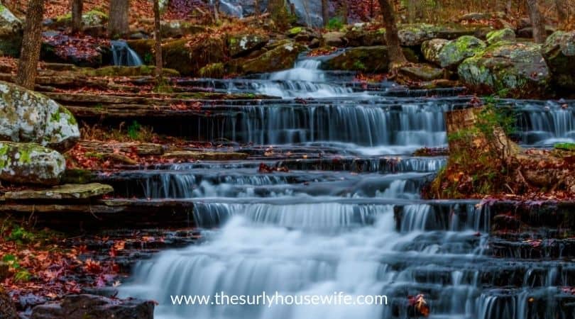 Waterfall along Collins Creek in Herber Springs Arkansas. Title image for blog post 20 children's books about Arkansas