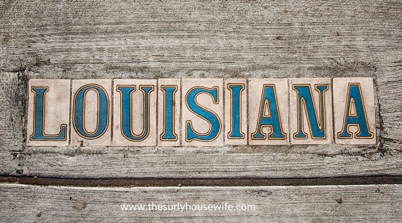 Louisiana spelled out with tiles. Title image of blog post: The Ultimate list of Children's books about Louisiana