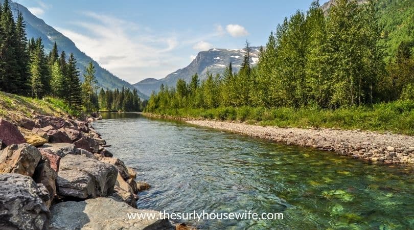 A river runs through Glacial National Park in Montana. Title image of blog post 20 children's books about Montana.
